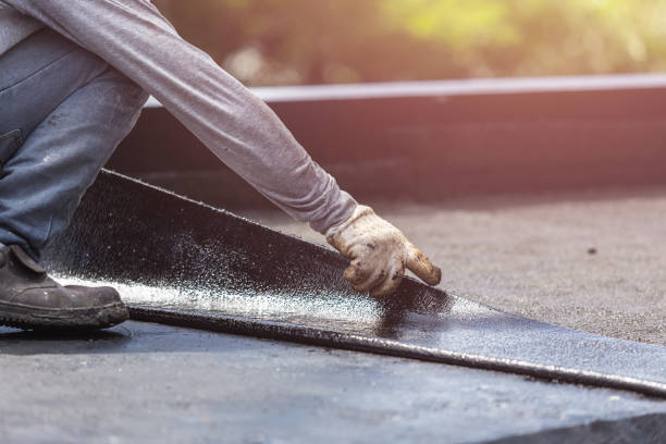 Professional Waterproofing technician working in Port Washington, NY